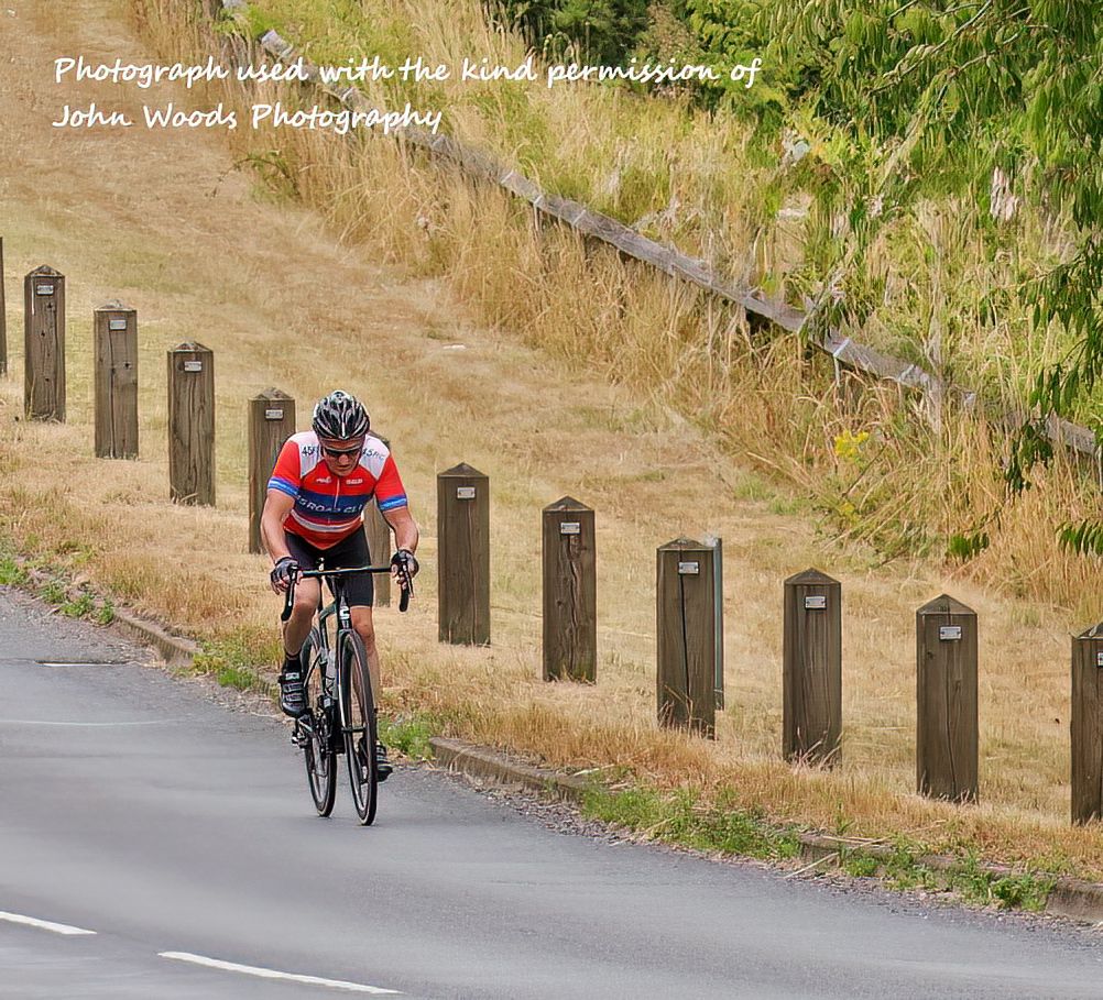 banner image, a cyclist on the road